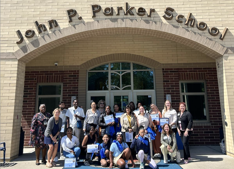 John P Parker Magnet school with Principal and staff