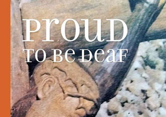 Poster-style image with the words “PROUD TO BE DEAF” over a natural background and an orange left border, conveying pride in deaf identity.