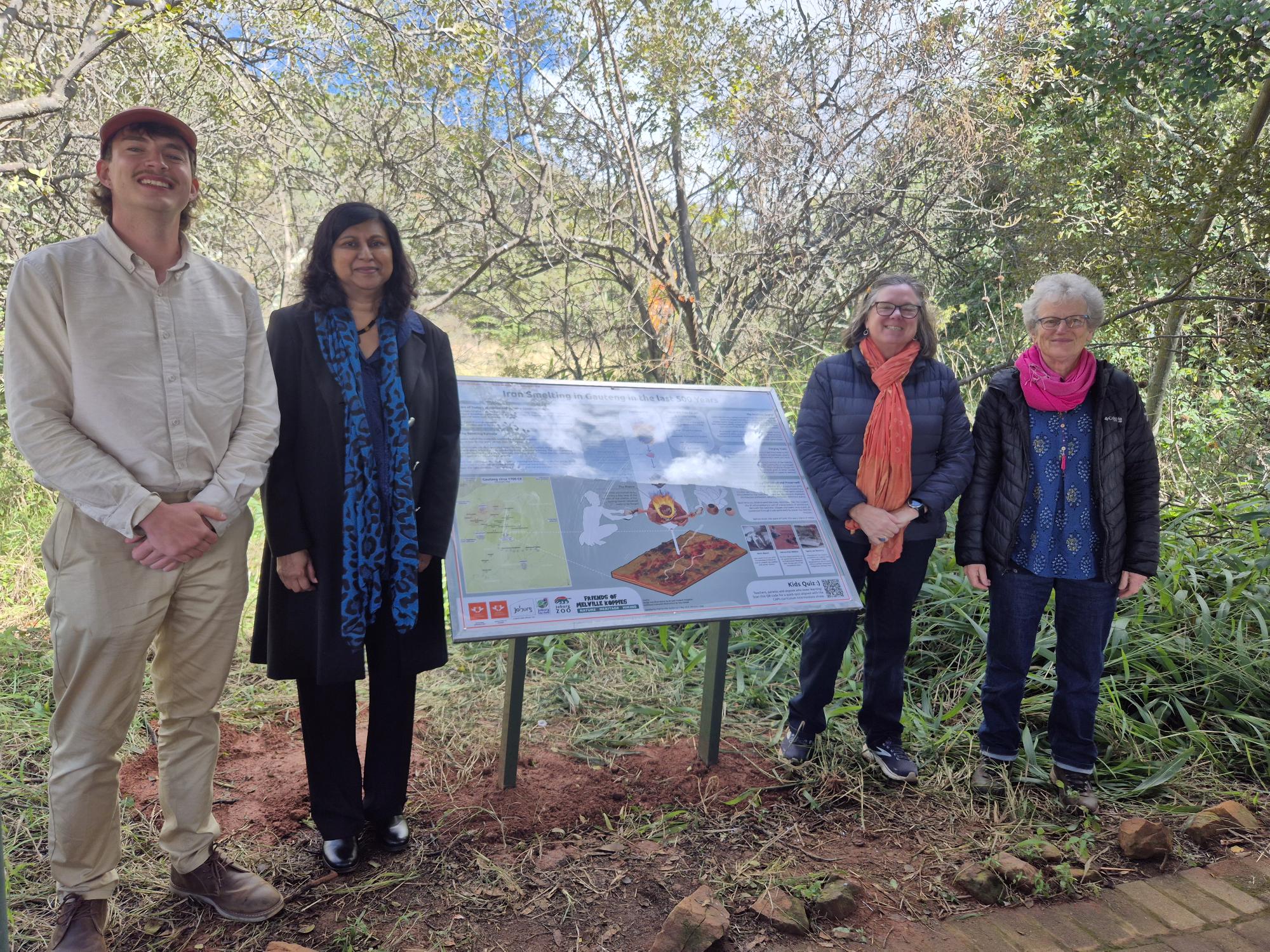 Dr Izak Potgieter, Prof Kammila Naidoo, Prof Natasha Erlank, and Jenny Grice stand next to the unveiled AR heritage experience